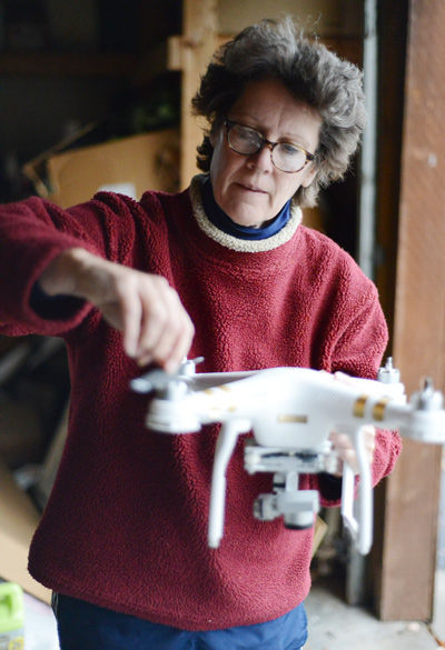 Jan Thompson, an SIU professor of radio, television and digital media, explains the operation of her drone Nov. 16, 2015, at her home. Thompson used the drone in Montana during filming for a documentary. (DailyEgyptian.com file photo)