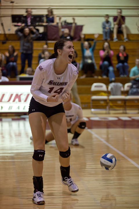 Then junior middle hitter McKenzie Dorris celebrates after a scored point during a match against Missouri State on Oct. 5, 2015, at Davies Gym.