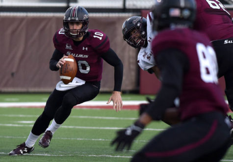 Redshirt freshman quarterback Tanner Hearn, of Florida, runs with the ball April 8 during’ second scrimmage game of the season at Saluki Stadium. (DailyEgyptian.com file photo)