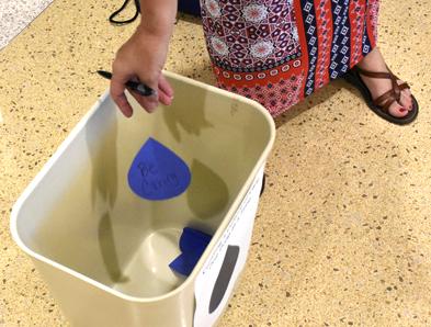 Assistant dean of students Deborah Barnett throws a teardrop-shaped cutout into a bucket Tuesday, Aug. 30, 2016, during the Salukis SPEAK forum in the Student Services Building. (Athena Chrysanthou | @Chrysant1Athena)