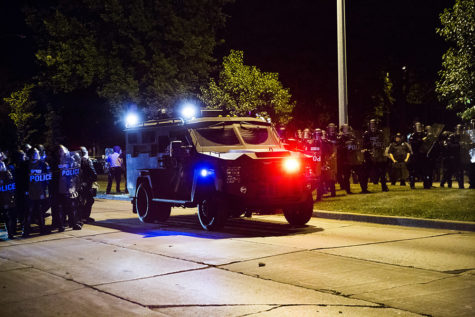 An armored vehicle positions itself to protect law enforcement after rocks and bottles were thrown by rioters during protests following a fatal police involved shooting the day before Sunday in Milwaukee, Wis. (Armando L. Sanchez/Chicago Tribune/TNS)