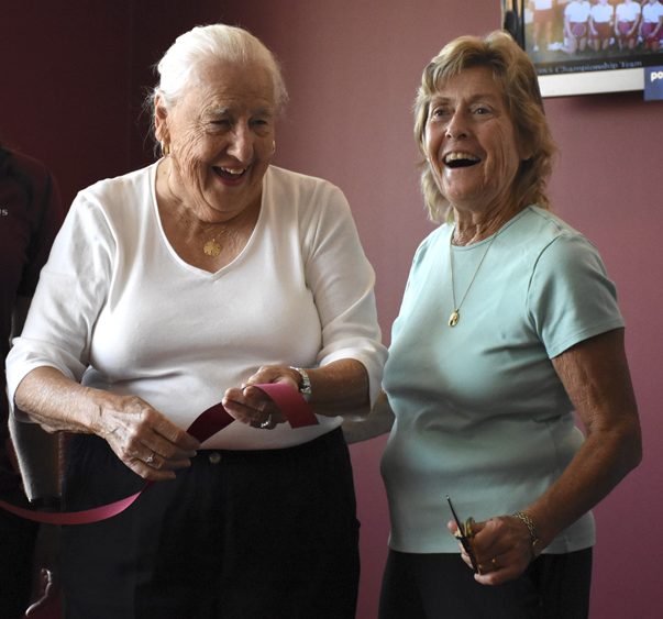 Retired SIU associate athletic director Charlotte West, left, and former women’s tennis coach Judy Auld cut a ribbon during a locker room dedication ceremony Saturday, Sept. 24, 2016, at SIU Arena. (Athena Chrysanthou | @Chrysant1Athena)