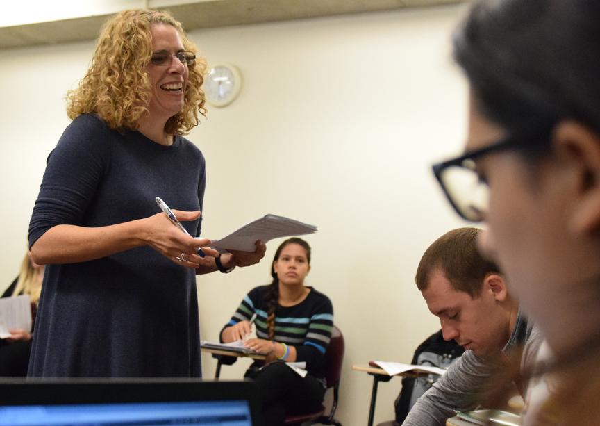 Associate Professor of Spanish Jennifer Smith, of Carbondale, speaks with a student Tuesday, Oct. 4, 2016, during her Neoclassicism and Romanticism class in Faner Hall. (Autumn Douglas | @autumn__douglas)