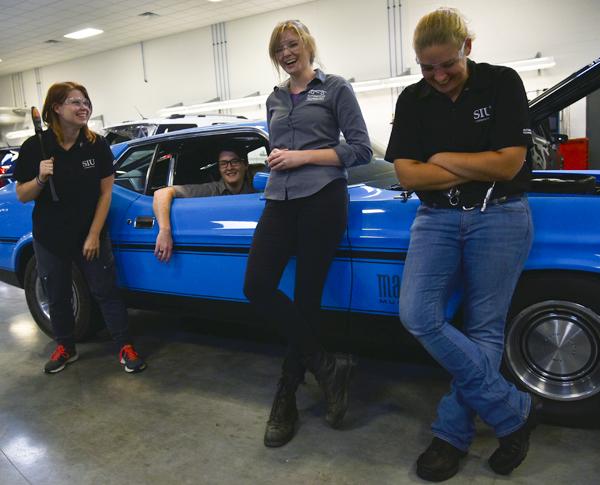 From left: Alli Giblin, of Gilberts, Melissa Vanderwater, of Plainfield, assistant instructor of automotive technology Jessica Suda and Alicia Johnston, of Dunlap, stand for a portrait Friday, Oct. 7, 2016, in SIU's Automotive Technology building. The three students are seniors in SIU's Automotive Technology program. “I realized I wanted to do something where I felt like I made a difference everyday,” Johnston said. “So I picked the automotive industry.” (Autumn Suyko | @AutumnSuyko_DE)
