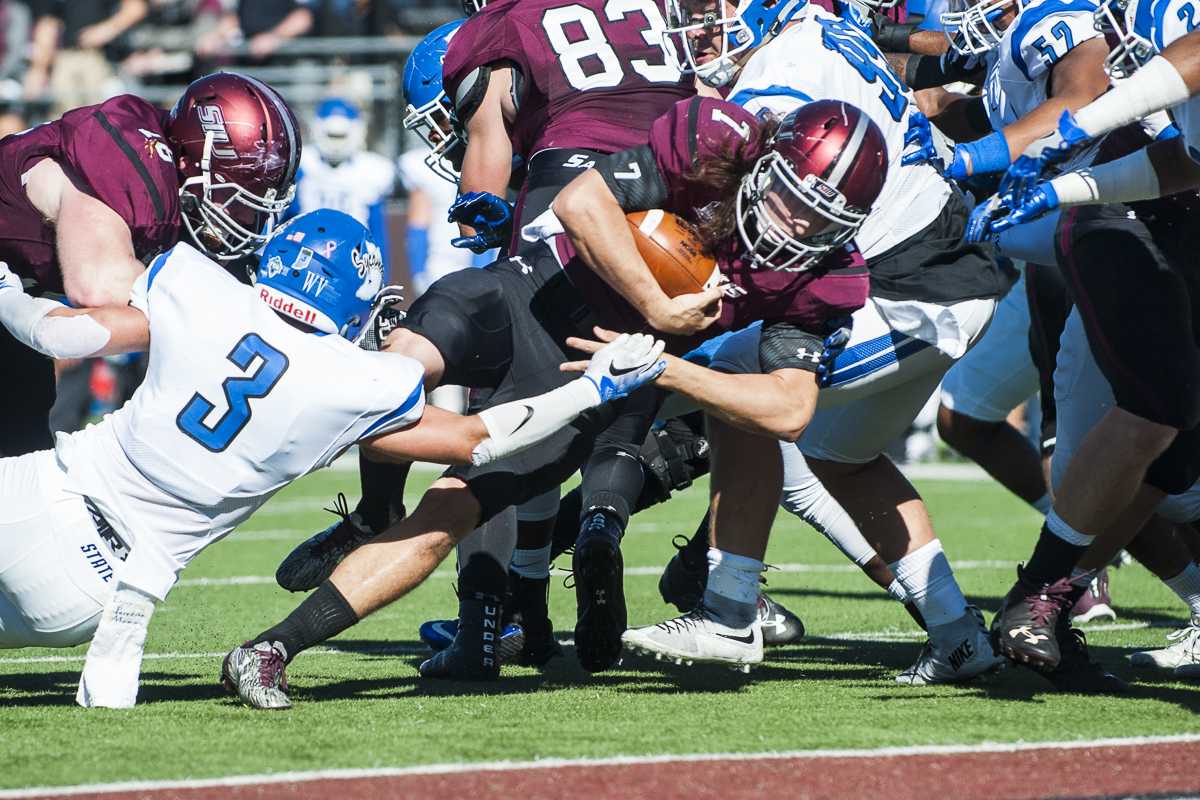 Sophomore quarterback Matt DeSomer (7) works to land a touchdown during the Salukis' homecoming match up against the Indiana State Sycamores on Saturday, Oct. 22, 2016, at Saluki Stadium. SIU lost the game by a score of 22-14. (Ryan Michalesko | @photosbylesko)