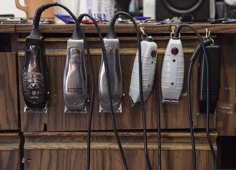 Half a dozen electric razors hang from the side of a cabinet at Arnette’s barber shop, which has been open since 1945. (Anna Spoerre | @annaspoerre)