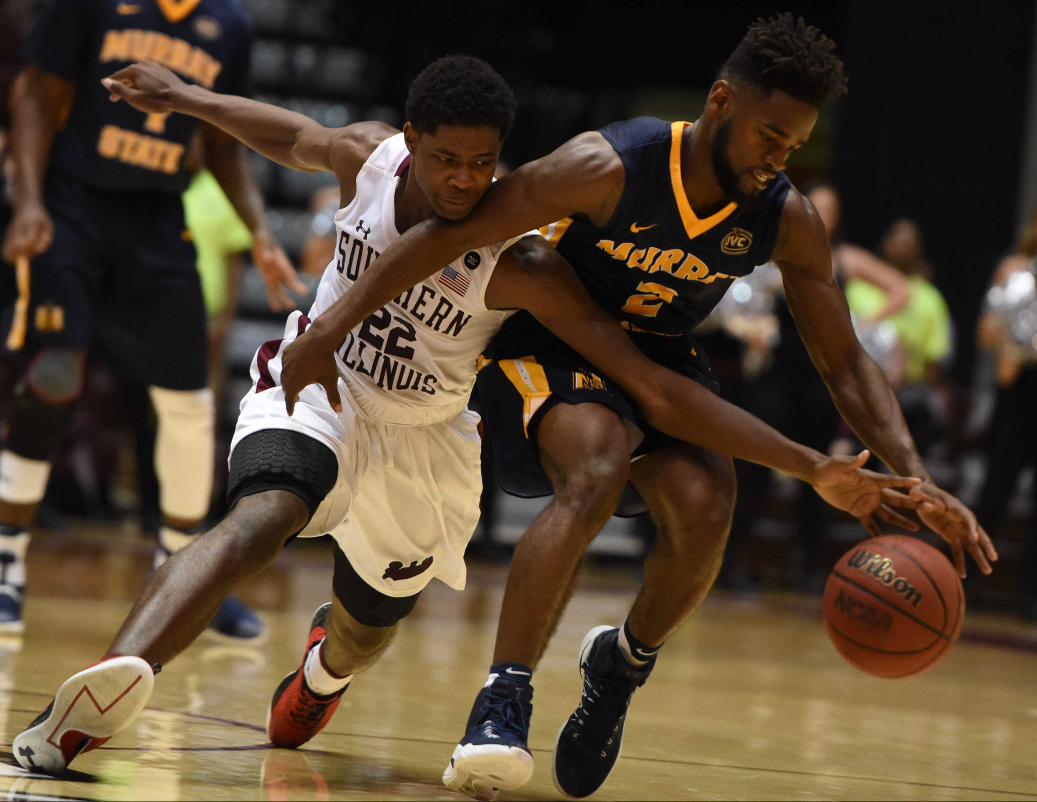 Saluki sophomore guard Armon Fletcher and Racer junior guard Jonathan Stark race for a loose ball Tuesday, Nov. 29, 2016, during SIU's 89-85 overtime win against Murray State at SIU Arena. (Bill Lukitsch | @lukitsbill)