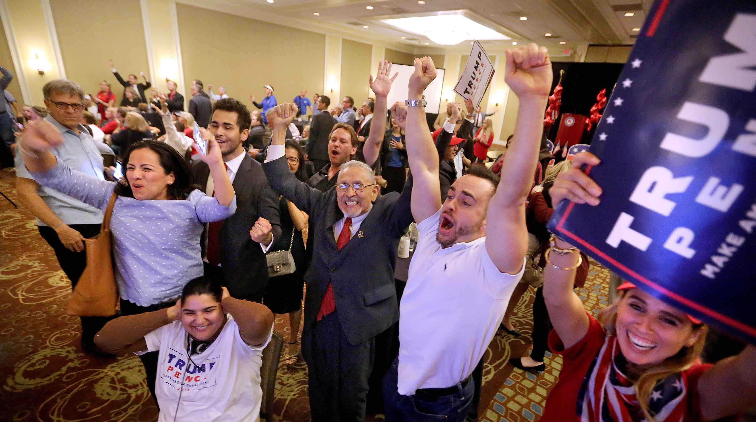 Trump supporters react as Fox News predict Donald Trump will win North Carolina at the Republican Party of Seminole County, Fla. Election Watch event on Nov. 8, 2016 in Altamonte Springs, near Orlando, Tuesday, Nov. 8, 2016. (Joe Burbank/Orlando Sentinel/TNS)
