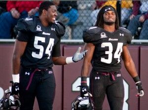 Kenneth Boatright, left, and Jayson DiManche laugh on the sidelines during SIUs game against Western Illinois University on Nov. 17 at Saluki Stadium. (DailyEgyptian.com file photo)