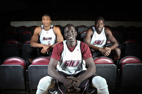 Bola Olaniyan, left, from Nigeria, Deng Leek, center, from Sudan, and Ibby Djimde, from Mali, pose for a portrait on Feb. 20, 2015, at SIU Arena before practice. (DailyEgyptian.com file photo)