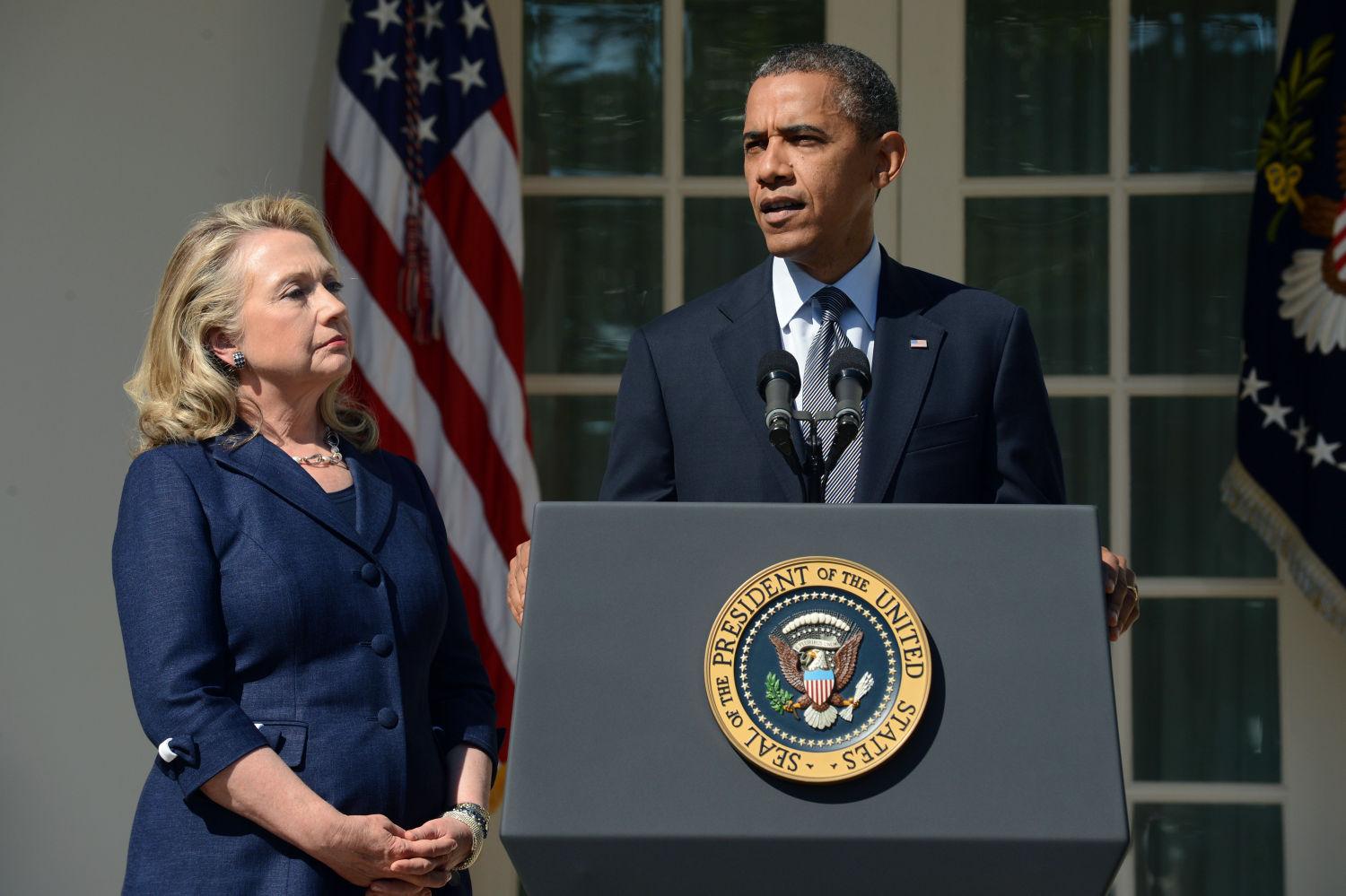 President Barack Obama delivers remarks beside Secretary of State Hillary Clinton, left, on the killing of US ambassador to Libya, Christopher Stevens, and three embassy staff, Wednesday, September 12, 2012, in the Rose Garden of the White House in Washington. (Pool photo by Michael Reynolds/EPA via Abaca Press/MCT)