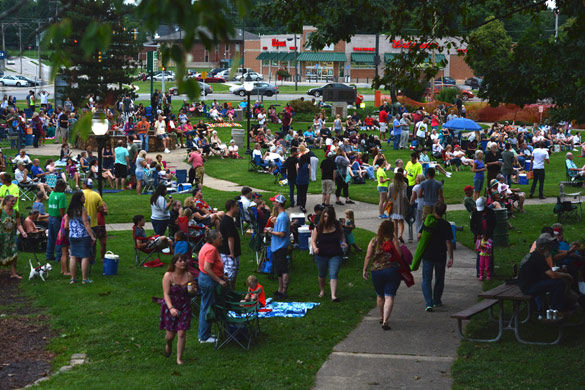 A crowd gathers as the Chris Canas Band begins playing Thursday, July 2, 2015 at Turley Park for the 37th annual Sunset Concert series organized by the Student Programming Council. Tim Porter, 30, attended the concert and said the series is important to Carbondale. 