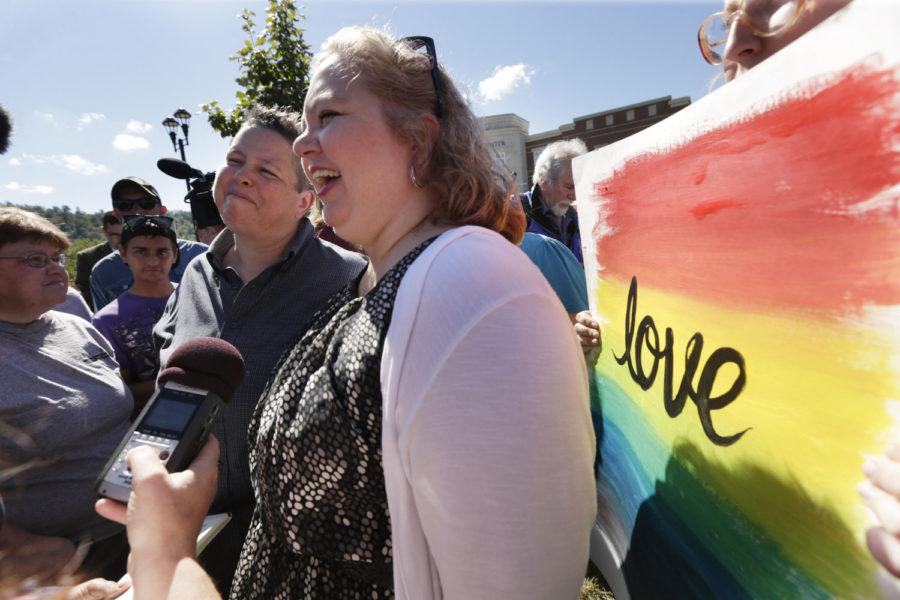 Shannon Wampler-Collins, left, and Carmen Wampler-Collins speak to the media after obtaining a marriage license at the Rowan County Courthouse on Monday in Morehead, Ky. Carmen Wampler-Collins and Shannon Wamper-Collins were the first couple to marry while Kim Davis was back at work. 