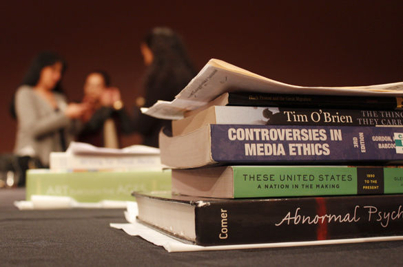 Textbooks are placed on a table at the Bookstore Scholarship Reception on Tuesday in Ballroom D of the Student Center. The SIU Alumni Association has awarded annual scholarships for textbooks and supplies to students since 2008.