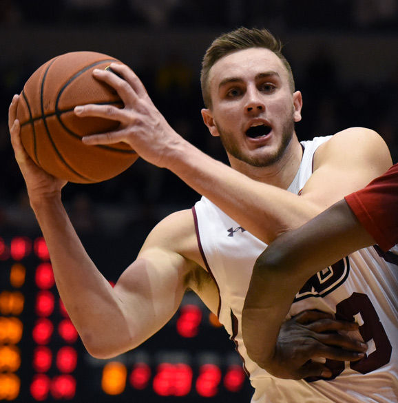 Junior forward Sean O'Brien looks to make a pass during SIU’s 71-59 victory against Bradley on Feb. 17 at SIU Arena. O’Brien led the Salukis in scoring with 24 points in the game. 