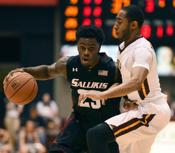 Saluki senior guard Anthony Beane dribbles the ball past Rambler senior guard Earl Peterson during SIU’s 73-59 loss to Loyola on Feb. 6 at SIU Arena. Beane finished with 18 points and 11 rebounds in the game for his first career double-double. (DailyEgyptian.com file photo)
