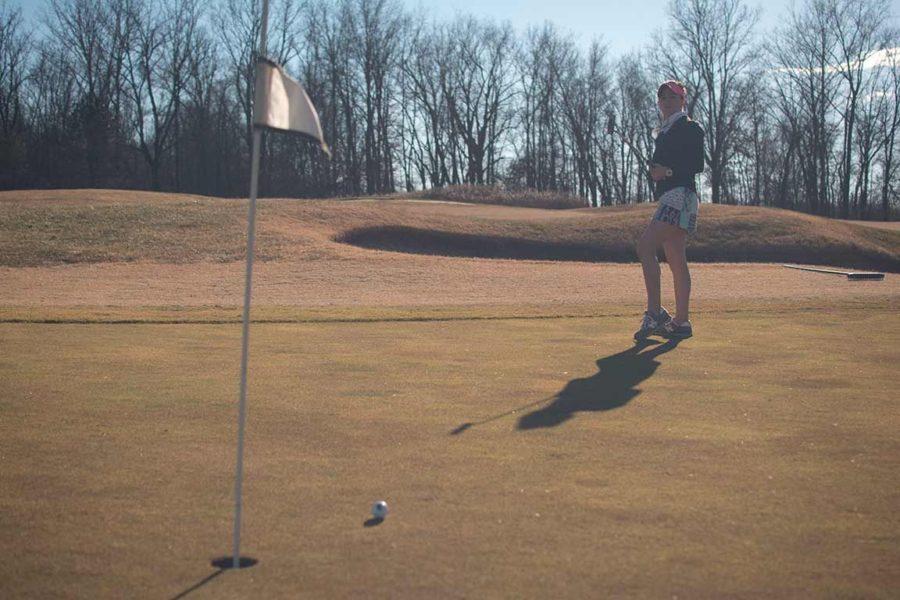 Brooke Cusumano, a then-junior from St. Louis studying accounting, practices her putting skills Feb. 1, 2016, while playing nine holes at the Hickory Ridge Golf Course in Carbondale. (DailyEgyptian.com file photo)