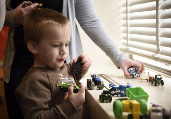 Dominick lines up toy cars along a windowsill under the supervision of Mary Foreman, a graduate student in communications disorders and science from Edwardsville, during a therapy session Tuesday at SIU’s Center for Autism Spectrum Disorders in Wham Education Building. The center will close after this semester if no state budget is passed. Valerie Boyer, director of SIU’s Center for Autism Spectrum Disorders, said the uncertainty is the most difficult part. “We’ve been waiting a long time,” said Boyer, an associate professor in communication disorders and sciences. “We feel like we perform a valuable community service so we would like to see it resolved, but honestly, just the knowing would be nice.” The center has been referring patients to Missouri, as the only facilities remaining in southern Illinois are private practices. “For a lot of people this isn’t an option because they can’t afford the out-of-pocket expenses,” Boyer said.