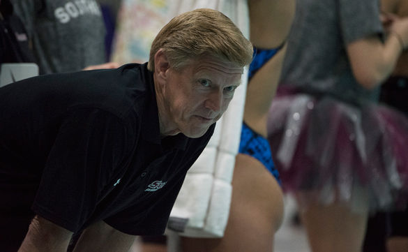 Swimming coach Rick Walker keeps a watchful eye as his swimmers perform during the 2016 Missouri Valley Conference Swimming and Diving Championships at Edward J. Shea Natatorium. SIU finished in first place on Saturday, becoming MVC Champions for the first time since 2007. 