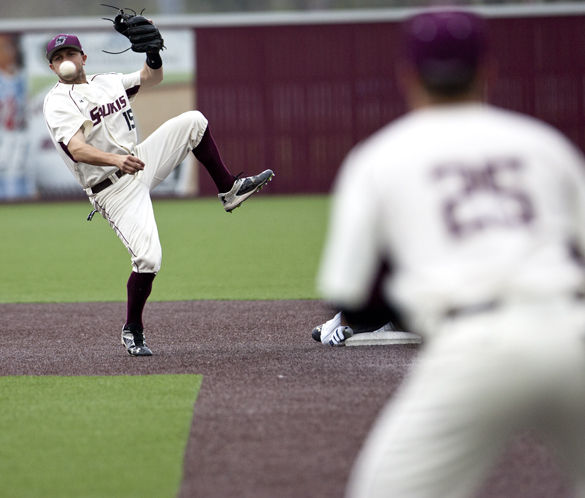 Junior infielder Will Farmer throws the ball to sophomore first baseman Logan Blackfan on Monday during SIU's 5-4 win against Murray State at Itchy Jones Stadium. Farmer had two hits during Wednesday's game. – March 30, 2016, Carbondale, Ill. (Aidan Osborne | Daily Egyptian)