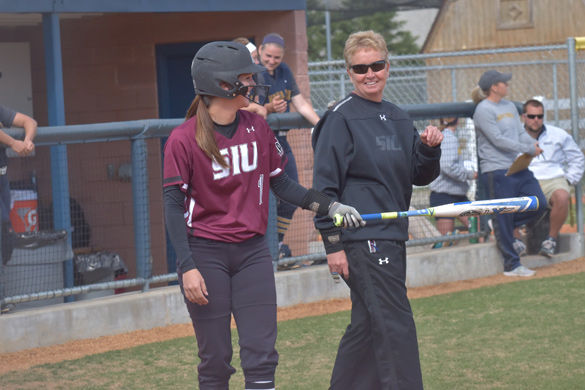 Then-junior center fielder Merri Anne Patterson smiles after a meeting with coach Kerri Blaylock on April 7, 2016  against Murray State at Racer Field in Murray, Ky. Patterson went 1-3 with an RBI and a walk in the 10-5 Saluki win.