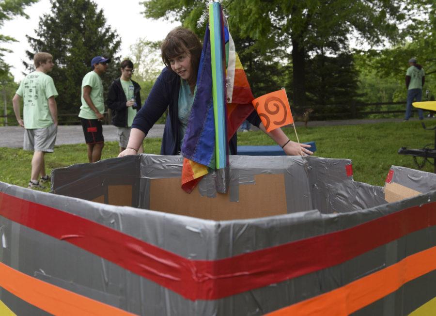 Emery Johnson-Miles, manager of the Rainbow Cafe LGBTQ Youth Center, moves the Rainboat on Saturday before the start of the 43rd Annual Great Cardboard Boat Regatta at the Carbondale Reservoir at Evergreen Park. Johnson-Miles, a Carbondale native, said this was the youth centers first entry in the regatta. We actually have a special fuel source, Johnson-Miles said. And that is rainbow power and pride. So thats whats going to be fuelling this boat as we journey across the great pond-lake. Johnson-Miles was joined in the Rainboat by Chip Loghry, of Marion. Although the Rainboat came last in its heat after capsizing, Johnson-Miles and Loghry said the day was a lot of fun. — April 30, 2016, Carbondale, Ill.