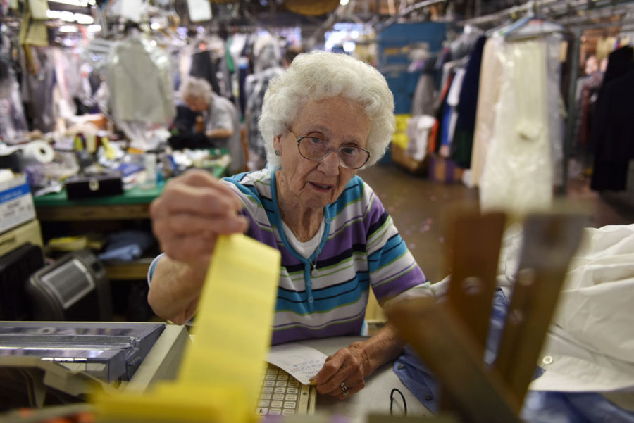Betty Louise Kiefer, of De Soto, grabs a tag for a customers order April 21 at Horstmans Cleaners & Furriers in Carbondale. Kiefer is 87 years old and has worked at the local dry cleaners since she was 18. When she started she wanted to help her husband with building their home in De Soto. “We’d order a load of lumber and we’d get that paid for and we’d order another load of lumber until we got our house built,” she said. Kiefer still lives in the same house her husband built. She said she likes working so she continued doing it. “I just like it and people seem to like me,” Kiefer said. “They expect me to be out there if they come. I’m the fixture at Horstman’s Cleaners.” — April 21, 2016, Carbondale, Ill. (Jacob Wiegand | Daily Egyptian)