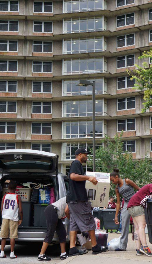 Students unload their belongings as they move into the dormitories Thursday, Aug. 18, 2016, on East Campus. More students are scheduled to move into the residence halls Friday and Saturday. (Andy Phillippe | DailyEgyptian.com)