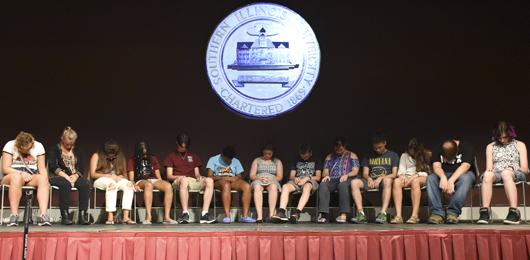 Hypnotized students slump in their seats Friday, Aug. 26, 2016, during Chris Jones’ performance at the Student Center. (Athena Chrysanthou | @Chrysant1Athena)