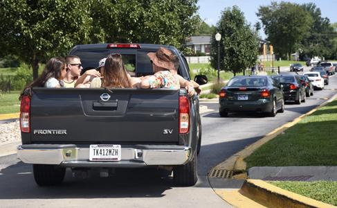 Partygoers leave The Reserve at Saluki Pointe on Saturday, Aug. 27, 2016, after police were called to disperse Solar Bear attendees. Carbondale police Lt. Paul Edwards estimated 600 people were gathered at the pool area of the apartment complex.  (Athena Chrysanthou | @Chrysant1Athena)