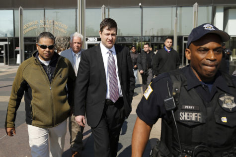 Officer Jason Van Dyke, center, leaves the Leighton Criminal Court Building in Chicago following a court appearance on May 5. (Jose M. Osorio/Chicago Tribune/TNS)