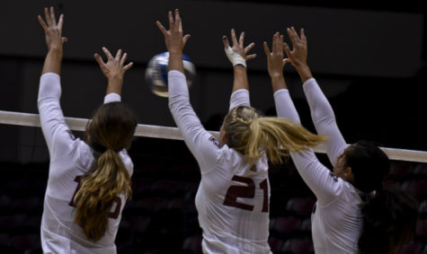 Left to right: Junior outside hitter Abby Barrow, junior middle hitter Alex Rosignol and senior setter/hitter Meg Viggars jump for the ball during the Salukis’ 3-2 win over Central Florida on Friday, Sept. 2, 2016, at SIU Arena. (Autumn Suyko | @AutumnSuyko_DE)