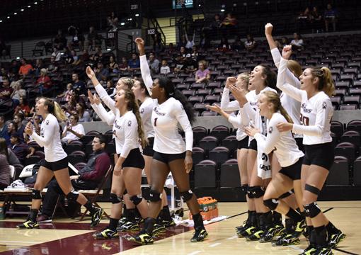 Saluki volleyball players celebrate during their 3-2 win against Central Florida Friday, Sept. 2. 2016, at SIU Arena. (Athena Chrysanthou | @Chrysant1Athena)