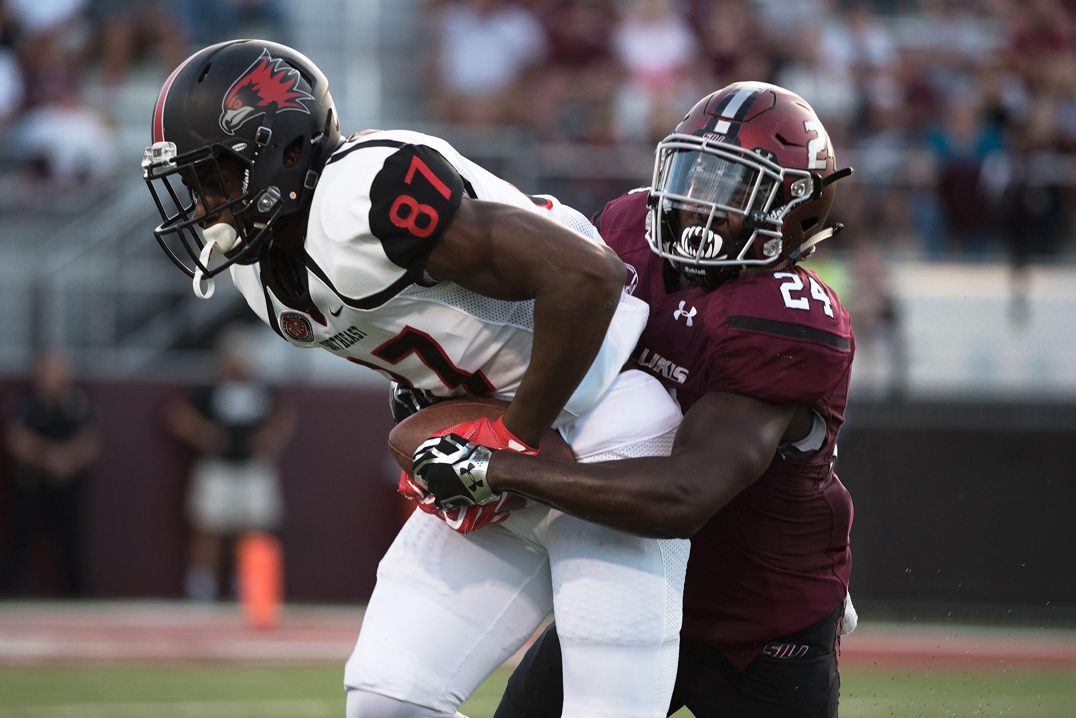 Saluki sophomore safety Jefferson Vea tackles SEMO redshirt freshman wide receiver Kristian Wilkerson during the first half of the Salukis' matchup against the Redhawks on Saturday, Sept. 10, 2016, at Saluki Stadium. (Jacob Wiegand | @JacobWiegand_DE)