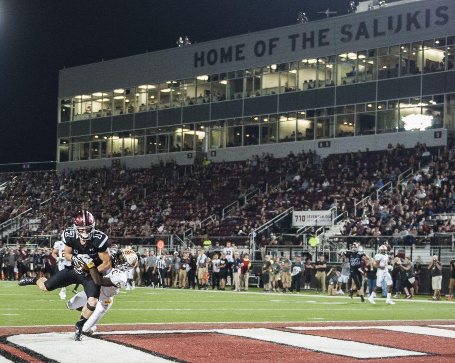 SIU senior wide receiver Billy Reed (17) lands a touchdown over Murray State sophomore defensive back Marquez Sanford (6) during the Salukis 50-17 win over the Racers on Saturday, Sept. 17, 2016, at Saluki Stadium. (Ryan Michalesko | @photosbylesko)