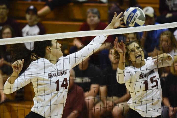 Senior middle hitter Mckenzie Dorris (14) and junior outside hitter Abby Barrow attempt a block during the Salukis 3-2 win over Northern Iowa on Friday, Sept. 23, 2016, at Davies Gym. (Athena Chrysanthou | @Chrysant1Athena)