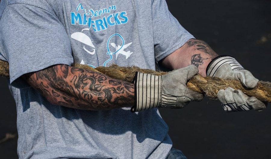 A participant grips the rope used to pull a Boeing 737 airplane on Saturday, Sept. 24, 2016, during the 2016 Plane Pull at Southern Illinois Airport in Murphysboro. Fifteen teams, comprised of eight participants each, competed in the event, which raised money for the southern Illinois chapter of the Special Olympics. (Ryan Michalesko | @photosbylesko) 