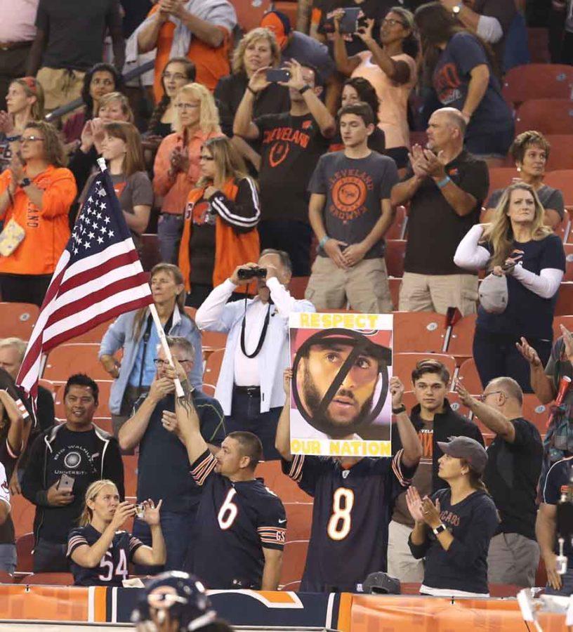 Chicago Bears fans make their views of San Francisco 49ers quarterback Colin Kaepernick known during the playing of the national anthem before a pre-season game against the Cleveland Browns on Thursday, Sept. 1, 2016, at FirstEnergy Stadium in Cleveland. (Phil Masturzo/Akron Beacon Journal/TNS)