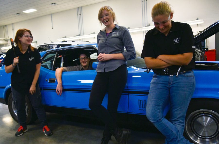 From left: Alli Giblin, of Gilberts, Melissa Vanderwater, of Plainfield, assistant instructor of automotive technology Jessica Suda and Alicia Johnston, of Dunlap, stand for a portrait Friday, Oct. 7, 2016, in SIUs Automotive Technology building. The three students are seniors in SIUs Automotive Technology program. “I realized I wanted to do something where I felt like I made a difference everyday,” Johnston said. “So I picked the automotive industry.” (Autumn Suyko | @AutumnSuyko_DE)