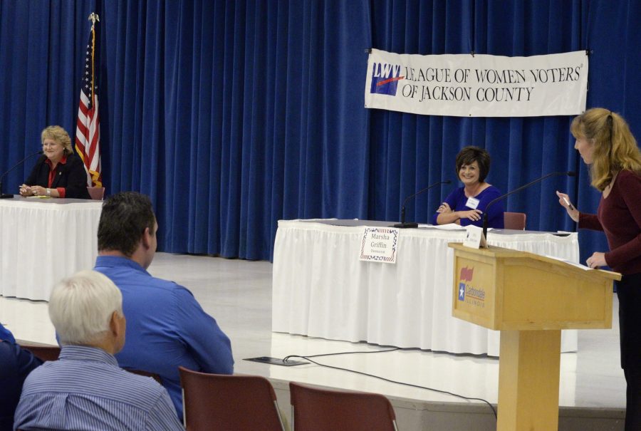 Forum moderator Laura Van Abbema, right, explains some ground rules for answering questions to Republican Rep. Terri Bryant, left, and Democratic challenger Marsha Griffin, center, both candidates for the Illinois House of Representatives District 115 seat, Friday, Oct. 14, 2016, at the Carbondale Civic Center. (Bill Lukitsch | @lukitsbill)