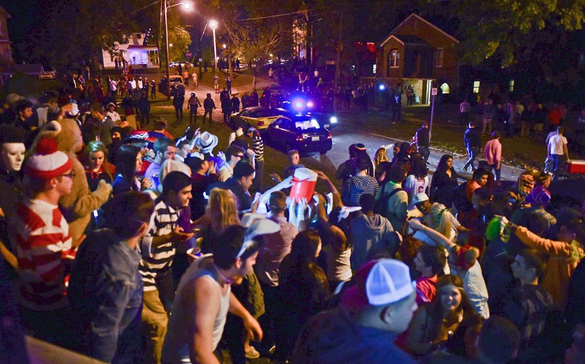 Partygoers congregate during Unofficial Halloween 2014 in Carbondale. (DailyEgyptian.com file photo)