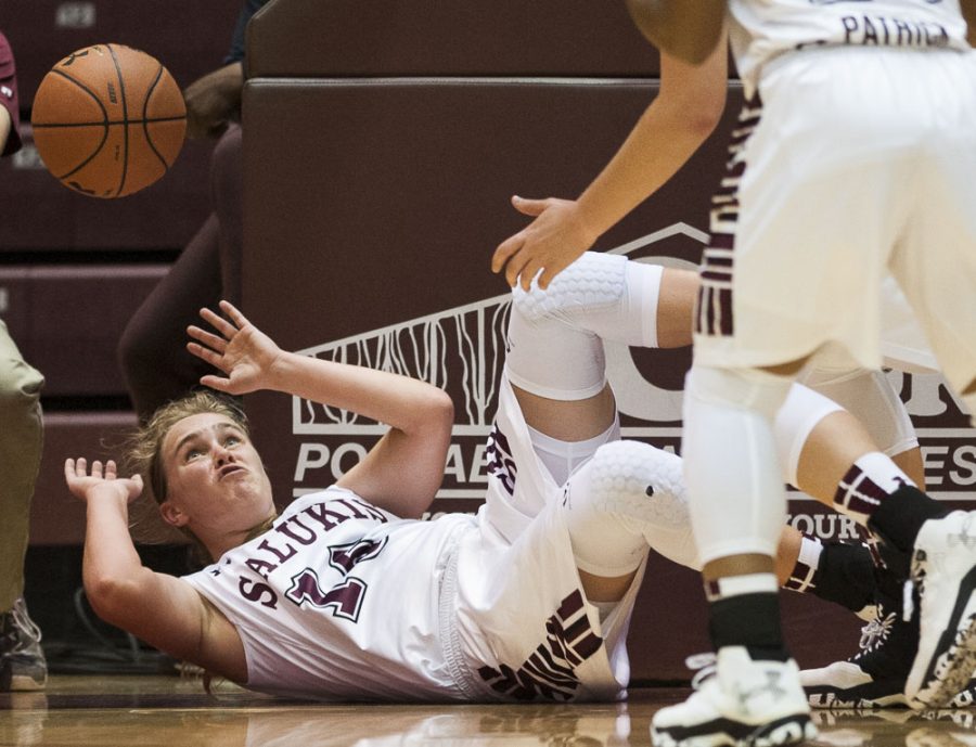 Freshman guard Caitlyn Claussen attempts to recover a loose ball during the Salukis 78-58 win over the William Woods Owls on Thursday, Oct. 27, 2016, at the SIU Arena. (Ryan Michalesko | @photosbylesko)