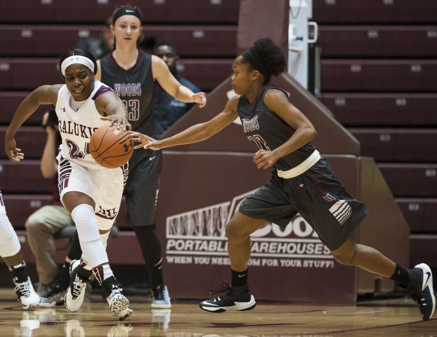 Senior forward Kim Nebo (24) and William Woods freshman guard Kaycee Gerald attempt to cover a loose ball during the Salukis 78-58 win over the William Woods Owls on Thursday, Oct. 27, 2016, at the SIU Arena. (Ryan Michalesko | @photosbylesko)