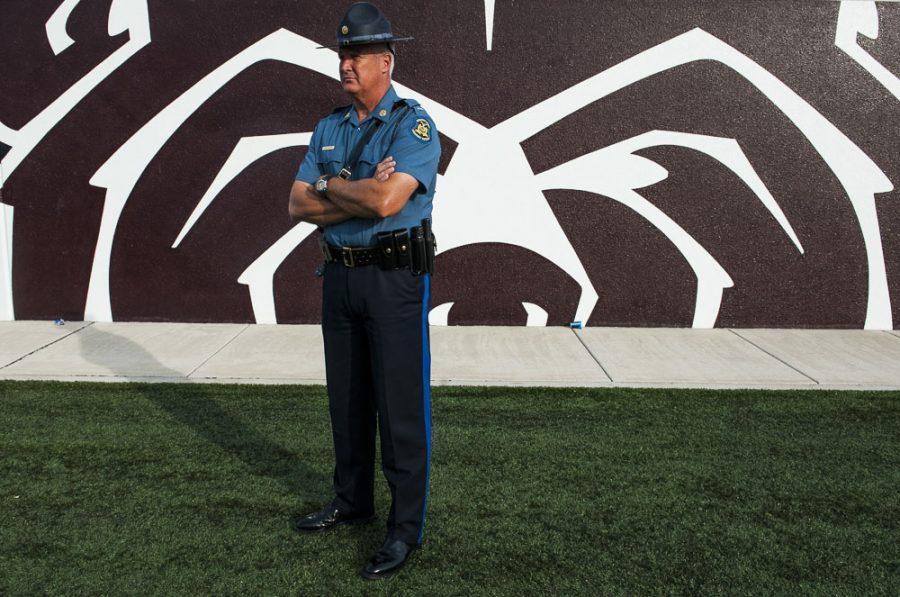 Lieutenant D. S. Bracker, of the Missouri State Highway Patrol, guards the sidelines during the Salukis 38-35 loss to the Missouri State Bears on Saturday, Oct. 29, 2016, in Springfield, Mo. (Ryan Michalesko | @photosbylesko)   