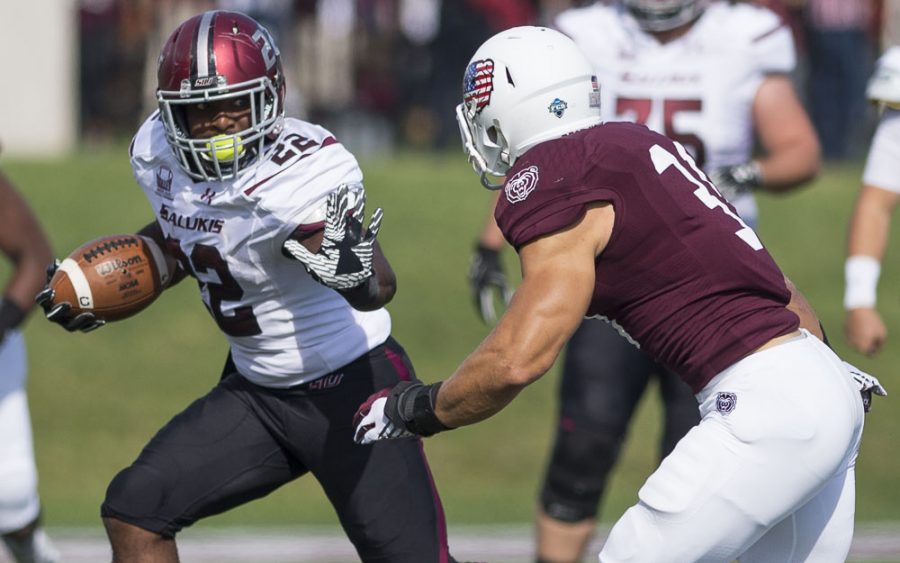 Junior running back Cameron Walter (22) makes a break past Missouri State senior linebacker Dylan Cole (31) during the first half of the Salukis 38-35 loss to the Bears in Springfield, Mo. (Daily Egyptian File Photo)