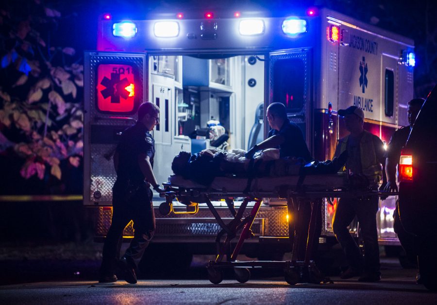 The victim of a stabbing is loaded into an ambulance Sunday, Oct. 30, 2016, in the 600 block of North Michael Street in Carbondale. (Ryan Michalesko | @photosbylesko)