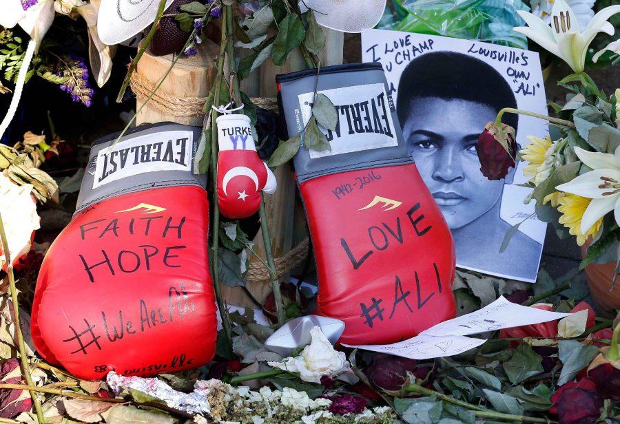 Boxing gloves left at the makeshift memorial at the Muhammed Ali Center in downtown Louisville, Ky., on Friday, June 10, 2016. Ali, a three-time world heavyweight champion, died June 3, 2016, at 74. (Charles Bertram/Lexington Herald-Leader/TNS)