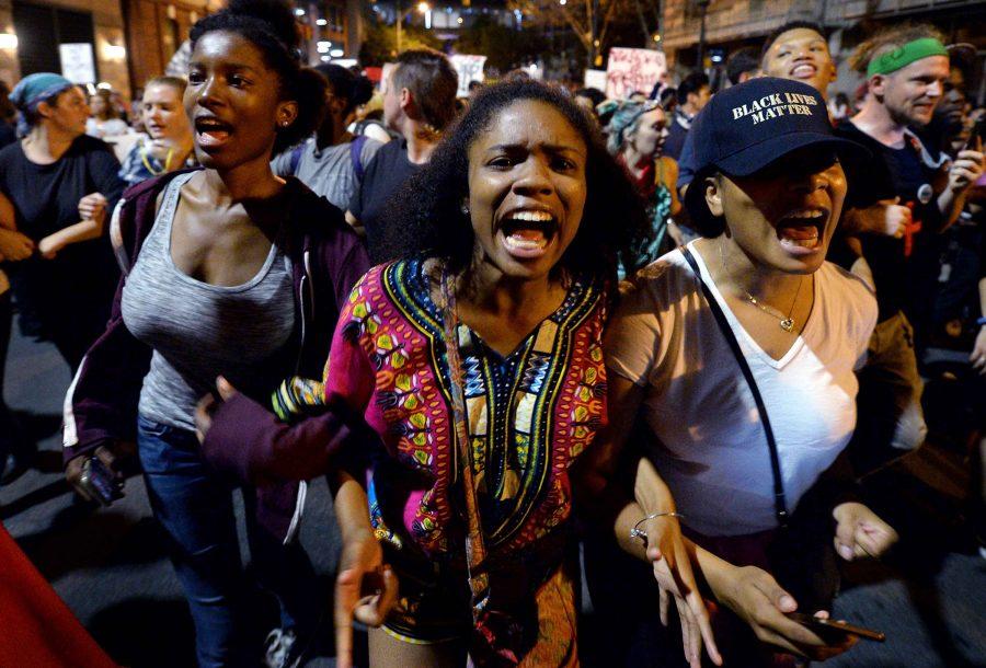 Protesters chant Black Lives Matter as they march throughout the city of Charlotte, N.C., on Friday, Sept. 23, 2016, as demonstrations continue following the shooting death of Keith Scott by police earlier in the week. (Jeff Siner/Charlotte Observer/TNS)