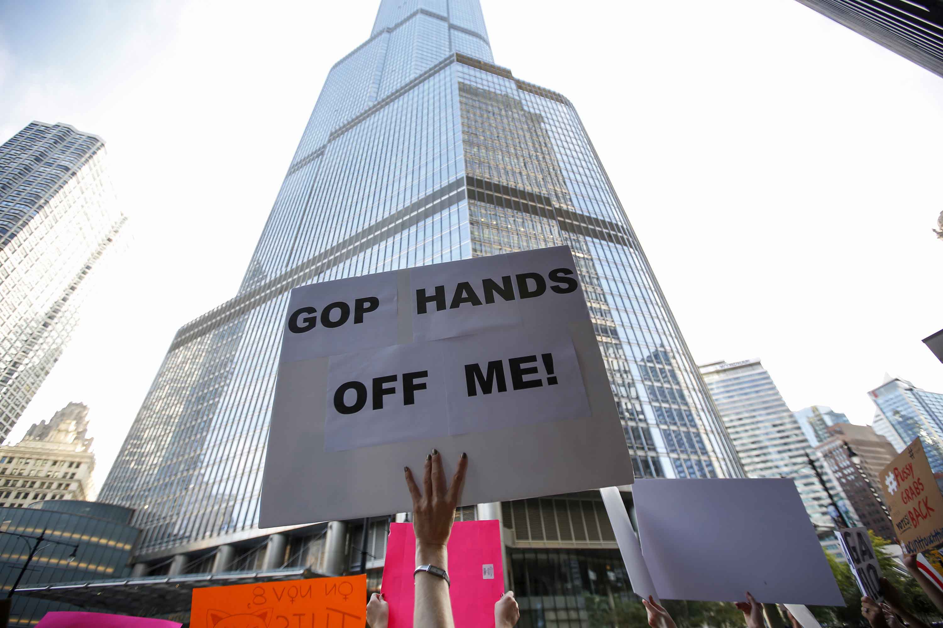 Protesters in opposition to Donald Trump's misogyny protest across the street from Trump Tower on Tuesday, Oct. 18, 2016 in Chicago. (Jose M. Osorio/Chicago Tribune/TNS)