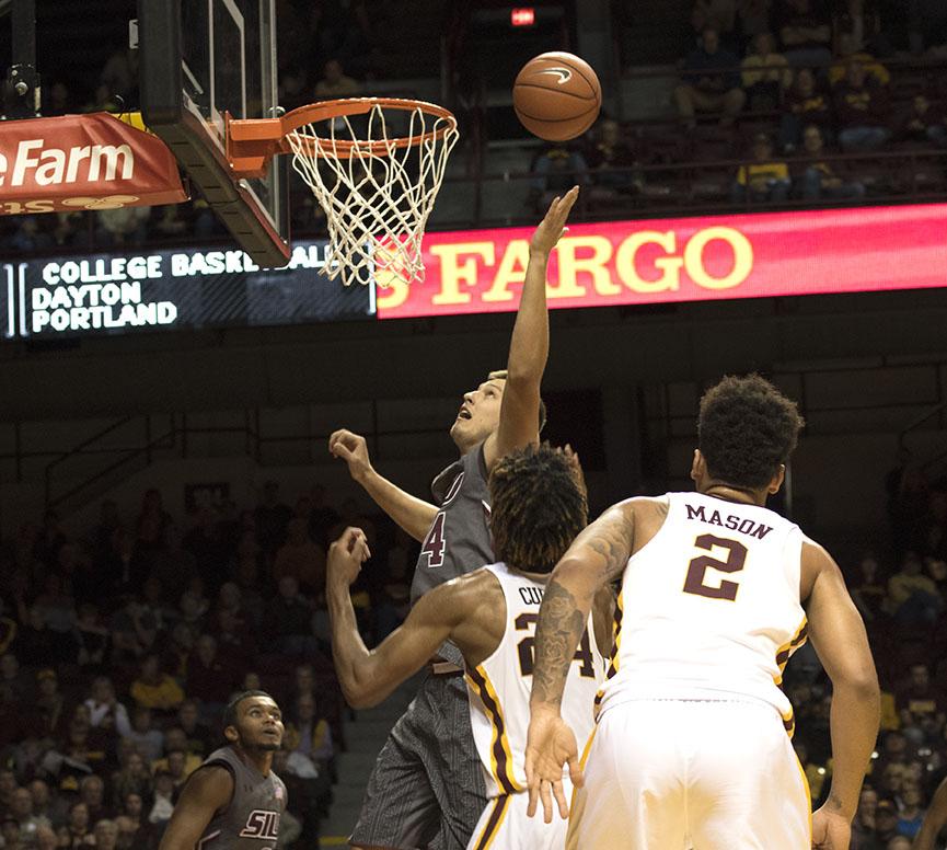 Sophomore forward Rudy Stradnieks attempts a basket Friday, Nov. 25, 2016, during the Salukis' 57-45 loss to the University of Minnesota at Williams Arena in Minneapolis. (Athena Chrysanthou | @Chrysant1Athena)